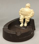 A Vintage Michelin man bakelite ashtray