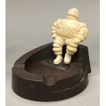 A Vintage Michelin man bakelite ashtray