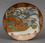 A late 19th century Japanese charger decorated in the Kutani manner, centred with floral sprays,