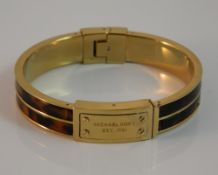 A Michael Kors bangle form bracelet