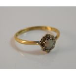 An 18 ct gold opal and diamond cluster ring (1.