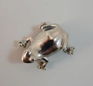 A silver frog