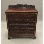 A Chinese carved hardwood chest of drawers