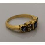 A 18 ct gold, diamond and sapphire ring (4.