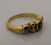 A 18 ct gold, diamond and sapphire ring (4.
