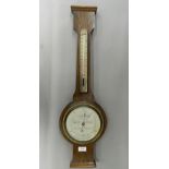 An oak cased banjo barometer