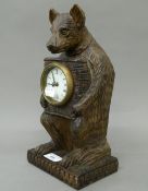 A wooden bear clock