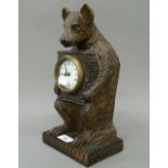 A wooden bear clock