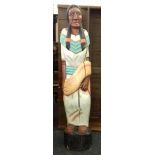 A large painted wooden model of a Native American Indian