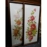 A pair of early 20th century florally painted glass panels