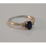 A 9 ct gold diamond and sapphire three stone ring (1.