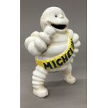 A cast iron model of a Michelin Man