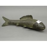 A bronze model of a fish