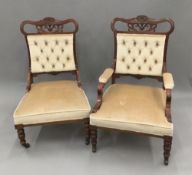 A pair of Victorian (his and hers) upholstered button back chairs