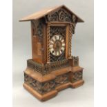A 19th century carved walnut cuckoo clock