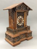 A 19th century carved walnut cuckoo clock