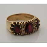 A 9 ct gold garnet set ring (7.