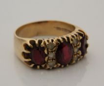 A 9 ct gold garnet set ring (7.