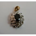 A 9 ct gold diamond and sapphire pendant
