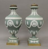 A pair of Jasper Ware candelabra. 37 cm high.