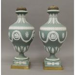 A pair of Jasper Ware candelabra. 37 cm high.