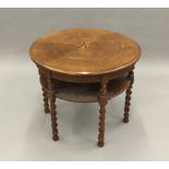 An inlaid oak barley twist centre table