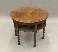 An inlaid oak barley twist centre table