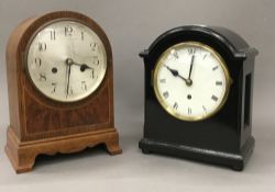 An ebonised mantle clock and an inlaid oak mantle clock