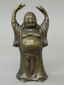 A bronze model of a Buddha