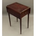 A Victorian mahogany twin flap work table