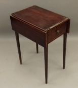 A Victorian mahogany twin flap work table