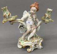 A Continental figural porcelain twin branch candlestick