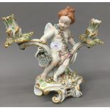 A Continental figural porcelain twin branch candlestick