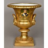 A Continental porcelain twin handled urn vase Gilt decorated enclosing a portrait roundel,