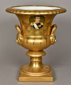 A Continental porcelain twin handled urn vase Gilt decorated enclosing a portrait roundel,