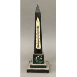 A 19th century specimen stone inset obelisk set with a thermometer