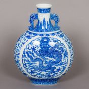 A Chinese porcelain blue and white moon flask With twin mask handles,