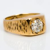 A 9 ct gold gypsy set diamond solitaire ring The brilliant cut stone just under 1 carat. 8mm high.