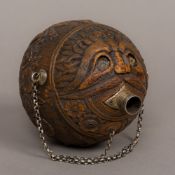 A 19th century carved coconut bugbear Of typical form,