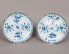 A pair of Chinese Kangxi blue and white porcelain dishes Each with a brown rim and decorated to the