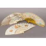 A 19th century painted silk fan With carved giltwood guards,