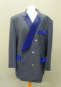 A blue on black double breasted jacket With blue velvet facings to pocket flaps.