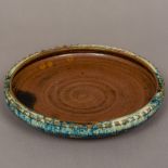 A Chinese pottery swallow dish With crimped rim and a blue exterior glaze. 15.5 cm diameter.