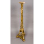 A 19th century carved giltwood torchere Of Corinthian column form, with acanthus carvings,