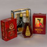 Four various bottles of Cognac Including: Hennessy XO (boxed),