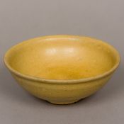 A Chinese pottery Song type bowl Of simple form, with creamy glaze. 15 cm diameter.