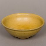 A Chinese pottery Song type bowl Of simple form, with creamy glaze. 15 cm diameter.