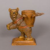 A carved wooden Black Forest bear Modelled standing,