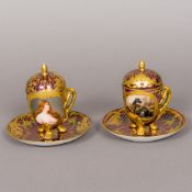A pair of 19th century Vienna porcelain covered chocolate cups and saucers One painted with a young