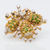 An 18K gold diamond spray brooch Set with three enamel decorated eggs. 4.5 cm high.